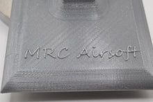 Load image into Gallery viewer, Display Stand for M4 / AR-15 Airsoft AEGs Easily store or display your Airsoft gun Compatible with most Airsoft rifles that uses regular M4 / M16 Airsoft AEG Magazines EMG Logo printed on stand These 3D printed items may need some sanding and could be rough from the printing process, the roughness will not hinder functionality.