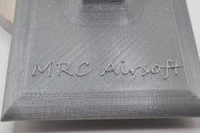 Load image into Gallery viewer, Get the stand personalized with what wording you would like. Easily store or display your Airsoft gun Compatible with most Airsoft rifles that uses regular M4 / M16 Airsoft AEG Magazines EMG Logo printed on stand These 3D printed items may need some sanding and could be rough from the printing process, the roughness will not hinder functionality.