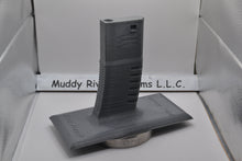 Load image into Gallery viewer, Display Stand for M4 / AR-15 Airsoft AEGs Easily store or display your Airsoft gun Compatible with most Airsoft rifles that uses regular M4 / M16 Airsoft AEG Magazines EMG Logo printed on stand These 3D printed items may need some sanding and could be rough from the printing process, the roughness will not hinder functionality.
