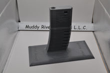 Load image into Gallery viewer, Display Stand for M4 / AR-15 Airsoft AEGs Easily store or display your Airsoft gun Compatible with most Airsoft rifles that uses regular M4 / M16 Airsoft AEG Magazines EMG Logo printed on stand These 3D printed items may need some sanding and could be rough from the printing process, the roughness will not hinder functionality.
